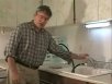 The author showing how you can boil water at room temperature. Click to start video.