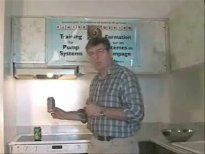 The author showing how to implode a can of pop. Click to start video.